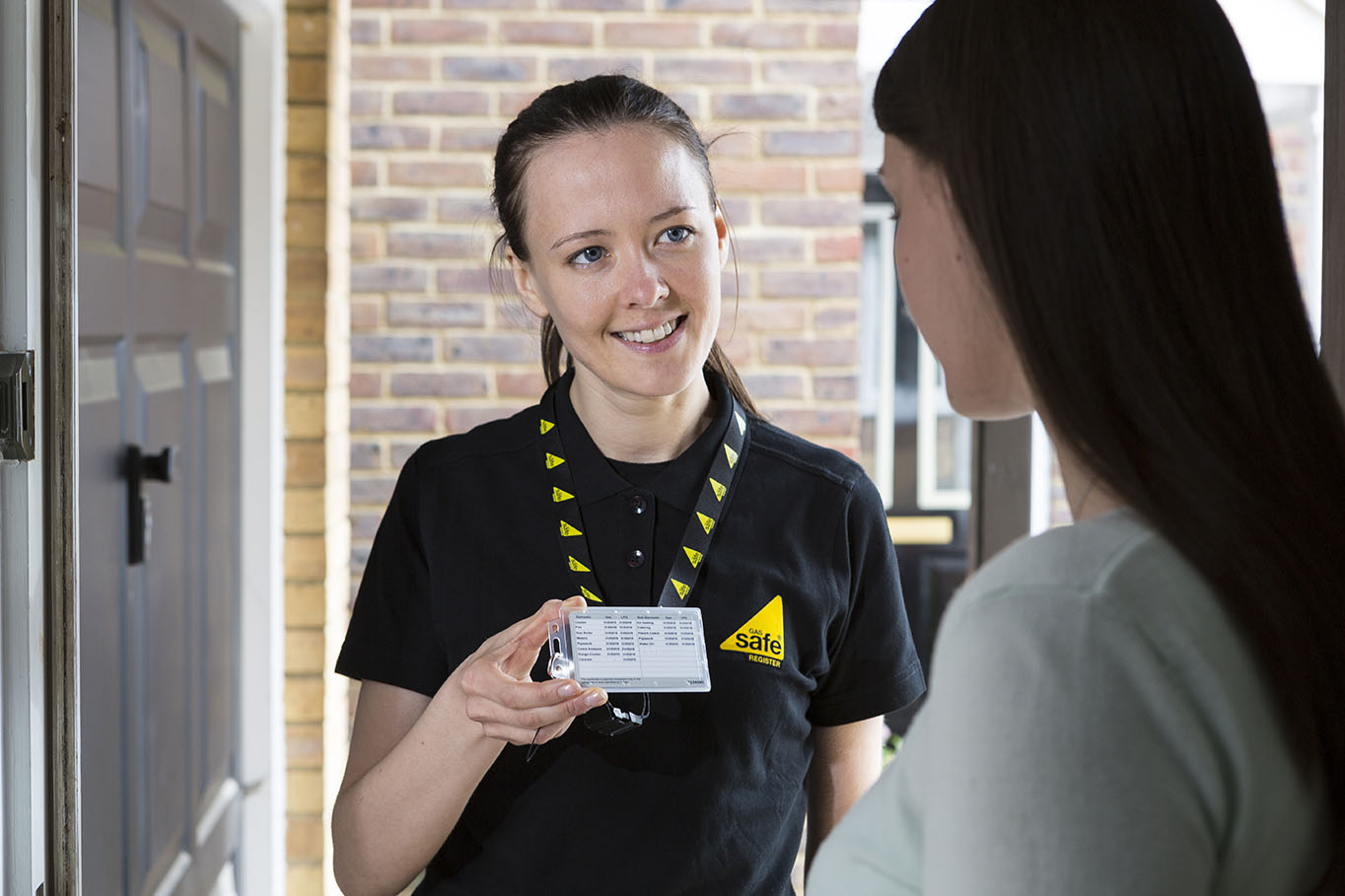 Engineer showing a Gas Safe ID card